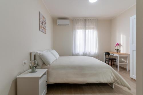 Postel nebo postele na pokoji v ubytování Agriturismo Cavalieri