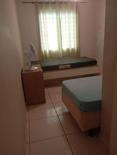 Ένα ή περισσότερα κρεβάτια σε δωμάτιο στο Casa praia matinhos