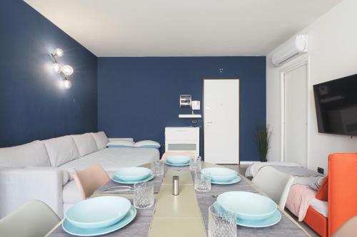 a living room with a table and a couch at CITY CENTER - Modern flat with FREE PARKING and WIFI - Apt A in Bergamo