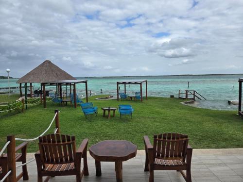 a playground on the beach with chairs and tables at Blue Caribe Bacalar Front Lagoon in Bacalar