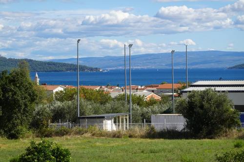 a city with a view of the water and buildings at PERISKA Home in Kaštela