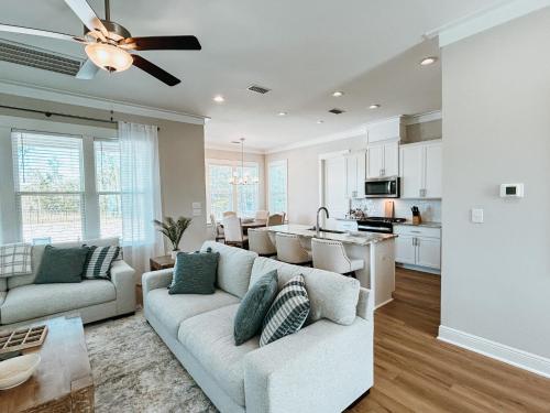 a living room with a couch and a kitchen at High Tides in Orange Beach