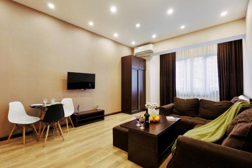 a living room with a couch and a table at Residence North Avenue, Teryan 8. 14 2 in Yerevan