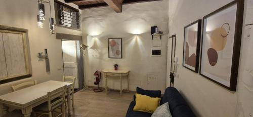 a living room with a couch and a table at Borgo San Frediano Hideaway in Florence