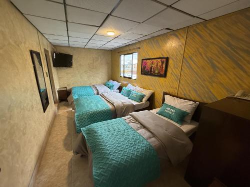 TV a/nebo společenská místnost v ubytování Hotel Suite Centro Bogotá