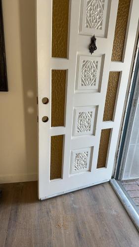 a door with a design on it in a room at New renovated room with shared bathroom in Hacienda Heights