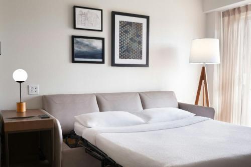 a bedroom with a bed and a table with a lamp at Residence Inn Tampa Westshore Airport in Tampa