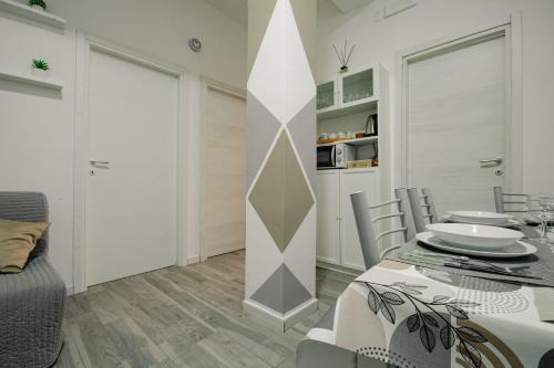 a kitchen and dining room with a table and chairs at Il Dubbio ai Quartieri Spagnoli in Naples