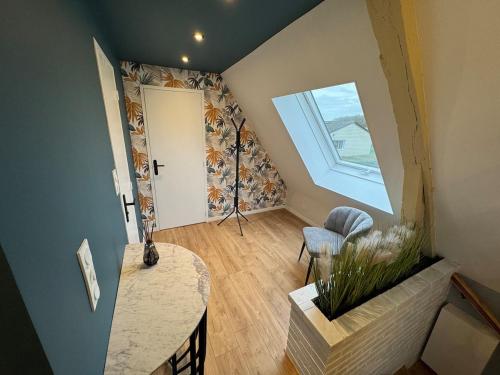 Et opholdsområde på Appartement Moderne et Cosy à Grand Bourgtheroulde Proche de la Côte Normande