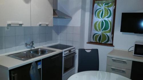 Η κουζίνα ή μικρή κουζίνα στο Apartments DaRi