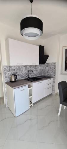 Η κουζίνα ή μικρή κουζίνα στο Apartments DaRi