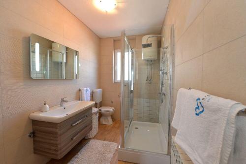Kúpeľňa v ubytovaní Apartments Olive Garden