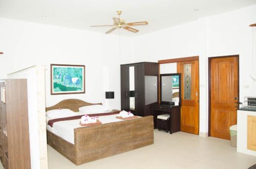 Ένα ή περισσότερα κρεβάτια σε δωμάτιο στο Jungle Village Bungalow