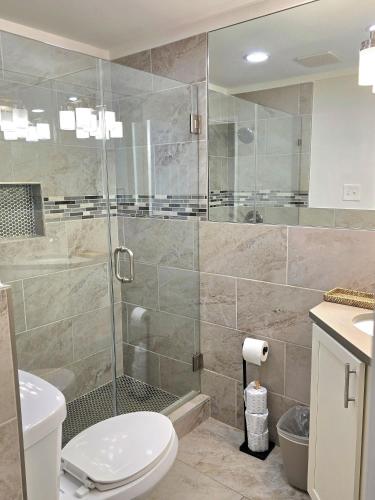 a bathroom with a shower and a toilet and a sink at Urban Oasis 1-Bedroom Condo in Atlanta in Atlanta