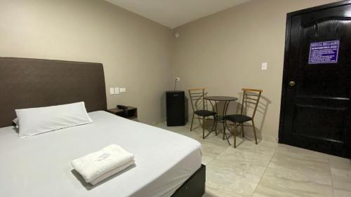 Postel nebo postele na pokoji v ubytování Hostal Bellagio