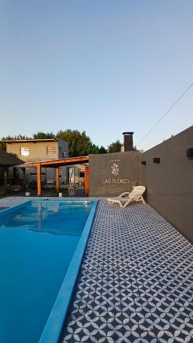 a swimming pool on the side of a building at Quinta Las Flores by Ginkgo Hostel in La Plata