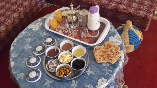 a table with a tray of food on it at Oasis de Tiout in Tiout