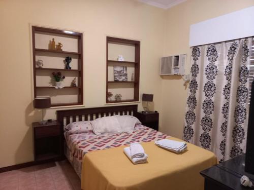 Ένα ή περισσότερα κρεβάτια σε δωμάτιο στο Casa céntrica amplia con patio