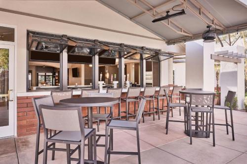 a restaurant with tables and chairs on a patio at Residence Inn Scottsdale North in Scottsdale