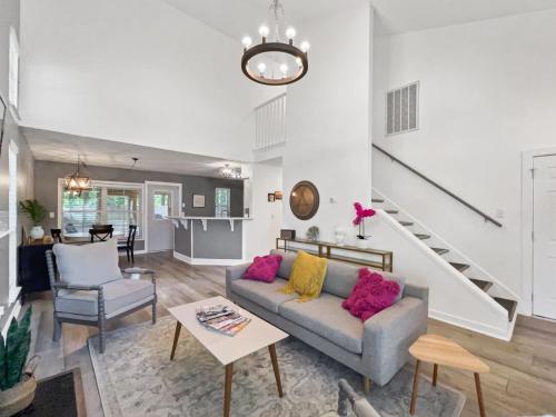 a living room with a couch and a table at The Paramour comfy home with ground floor bedroom and fenced in yard in Summerville