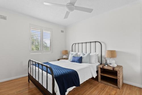 Ένα ή περισσότερα κρεβάτια σε δωμάτιο στο Beautiful 2 Bed Apt Walk 5mins Beach 3mins Village