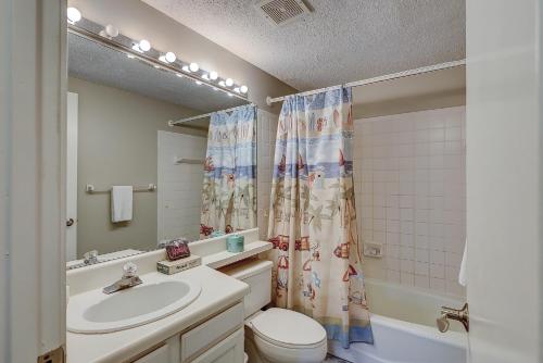 a bathroom with a sink and a toilet and a shower at Rare Large 3 BR Near Beach Shops Restaurants & Bars Huge Pool & Free Tennis in Hilton Head Island