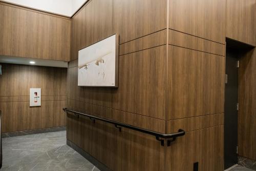 a hallway with wooden walls and a picture on the wall at Downtown Center Silverstone Tower I and II Long-Term Booking Only Your second home in Vancouver in Vancouver
