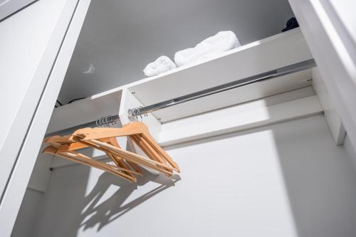 a room with a ladder and a chair on a shelf at Downtown Center Silverstone Tower I and II Long-Term Booking Only Your second home in Vancouver in Vancouver