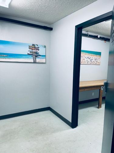 a room with two paintings on the wall and a window at Elite Hotel -Downtown Center- "Ski & Northern light Tour" "Hot Spring Tour "Long-term stay" in Whitehorse