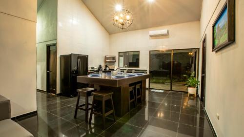 a bathroom with a counter with two sinks in it at Anthurium house in Fortuna