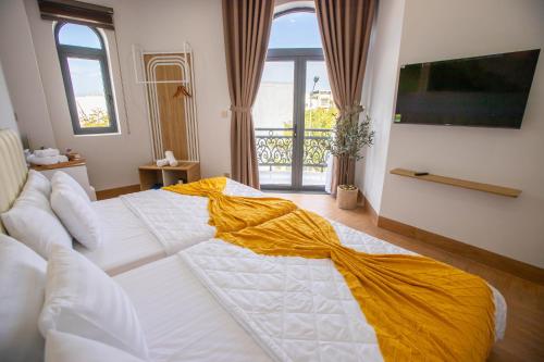 Ένα ή περισσότερα κρεβάτια σε δωμάτιο στο Villa An Nguyên Phan Rang