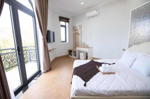 Ένα ή περισσότερα κρεβάτια σε δωμάτιο στο Villa An Nguyên Phan Rang