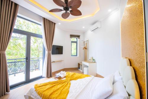 Ένα ή περισσότερα κρεβάτια σε δωμάτιο στο Villa An Nguyên Phan Rang