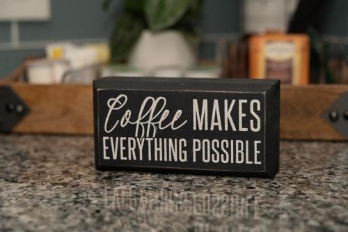 a black sign that says coffee makes everything possible at OTR's Hidden Gem in Cincinnati