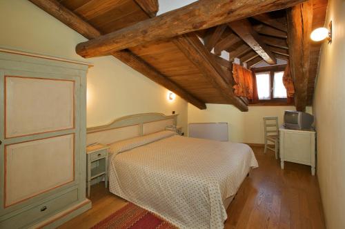 Postel nebo postele na pokoji v ubytování Hotel Chez Toi