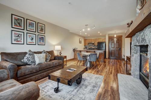a living room with a couch and a table at Cozy Ski Chalet with Large Balcony condo in Breckenridge