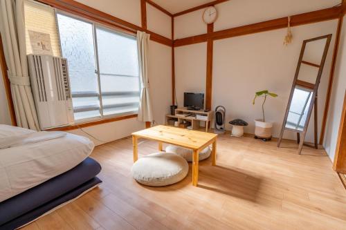 Ένα ή περισσότερα κρεβάτια σε δωμάτιο στο Kawamura Apartment 202