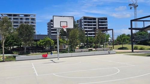 an empty basketball court with a basketball hoop at Azzure Escape in Kawana Waters