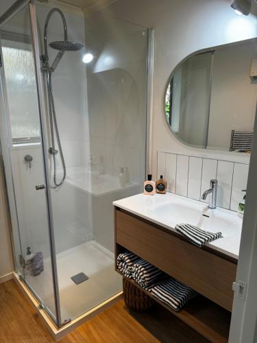 a bathroom with a shower and a sink at Esplanade Stay in Kaikoura