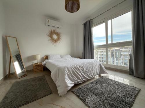 Ένα ή περισσότερα κρεβάτια σε δωμάτιο στο Elite Residence by the LOFT