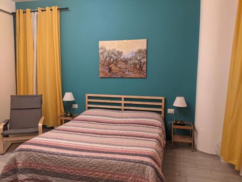 a bedroom with a bed and a painting on the wall at Lucky Lake in Verbania