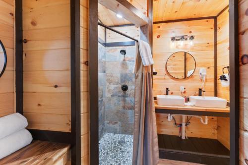 a bathroom with a shower and a sink at Mountain Majesty By Ghosal Luxury Lodging in Gatlinburg