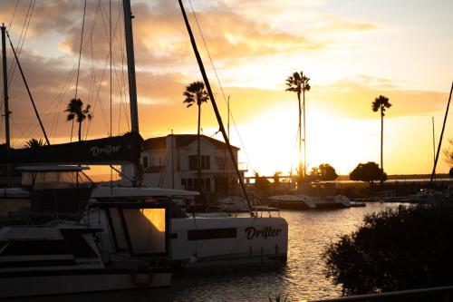 a boat docked in a marina at sunset at Dolphin Place in Velddrif