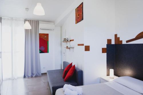 Ein Bett oder Betten in einem Zimmer der Unterkunft Le Cave di Fontane Bianche