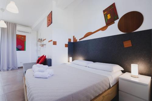 Ein Bett oder Betten in einem Zimmer der Unterkunft Le Cave di Fontane Bianche