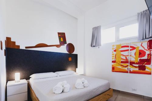 Ein Bett oder Betten in einem Zimmer der Unterkunft Le Cave di Fontane Bianche