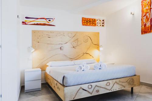 Ein Bett oder Betten in einem Zimmer der Unterkunft Le Cave di Fontane Bianche