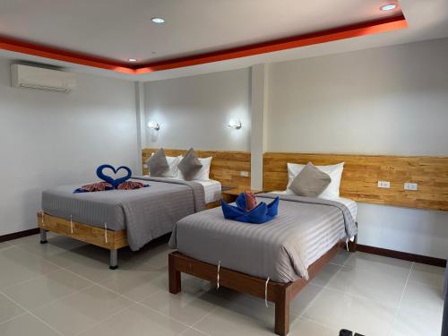 Postel nebo postele na pokoji v ubytování CheeVa Beach Resort