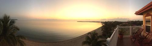 a view of the ocean from the balcony of a house at Belizean Nirvana in Placencia Village