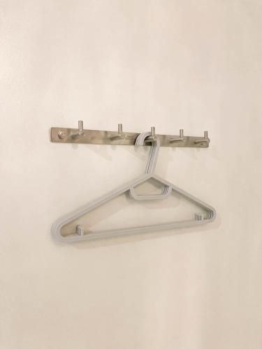 a metal towel rack hanging on a wall at Caleo Boracay Island Station 3 in Boracay